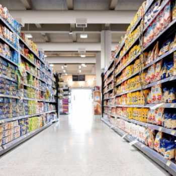 Empty aisle at a supermarket - grocery shopping concepts